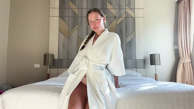 A young college girl indulges in some solo fun while staying at a hotel